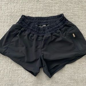 Gently used Lululemon black tracker run shorts, size 4